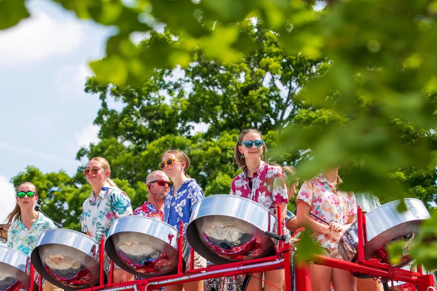 The Petoskey Steel Drum Band performs on its bus during the National Cherry Festival’s Cherry Royale Parade in 2025.