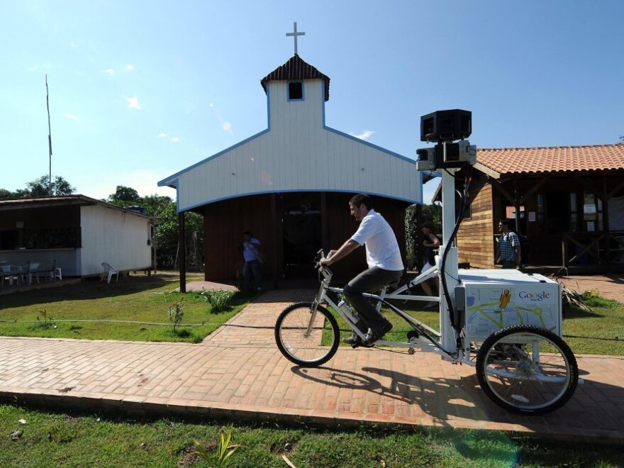 <p>A Google team member rides a Trike with a 360-degree camera system on it to record the "Street View for the Amazon" in Tumbira in August. Google says the images will be ready in a few weeks. </p>