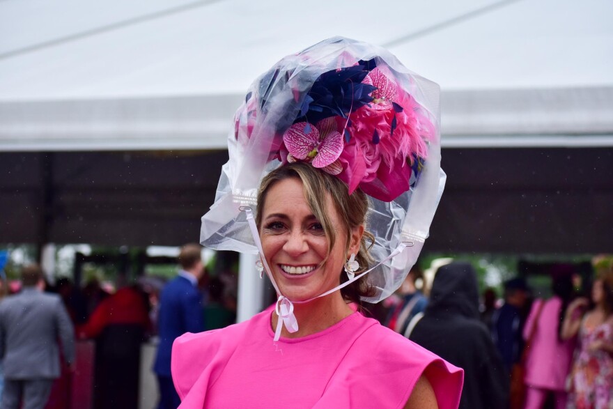 Rain ponchos covering a woman's head at the 2024 Kentucky Oaks