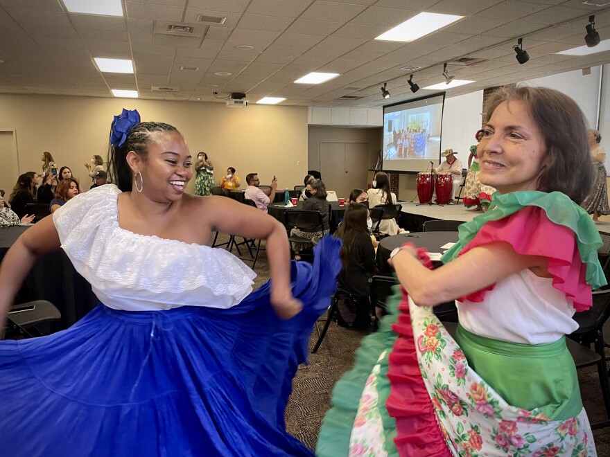 Two dancers with Grupo Atlántico performed at the 20th annual Cambio de Colores conference on June 23, 2022. The multi-state event focuses on the integration of Latino/a/x and Hispanic immigrants in new communities, with an emphasis on the Midwest. Grupo Atlántico performs folk dances that highlight African, Indian and Spanish roots from the Caribbean coast of Colombia and other countries.