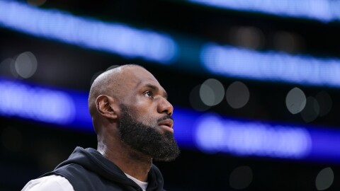 Los Angeles Lakers forward LeBron James looks on before an NBA basketball game against the Phoenix Suns, Friday, April 10, 2026, in Los Angeles. 
