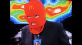 a person wearing a McDonalds balaclava 