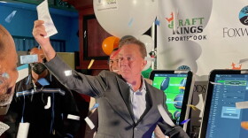 Glitter falls after Gov. Ned Lamont made his first sports bet in September 2021 at Foxwoods Resort Casino. The lottery badly trails Foxwoods and Mohegan Sun in sports-betting market share.