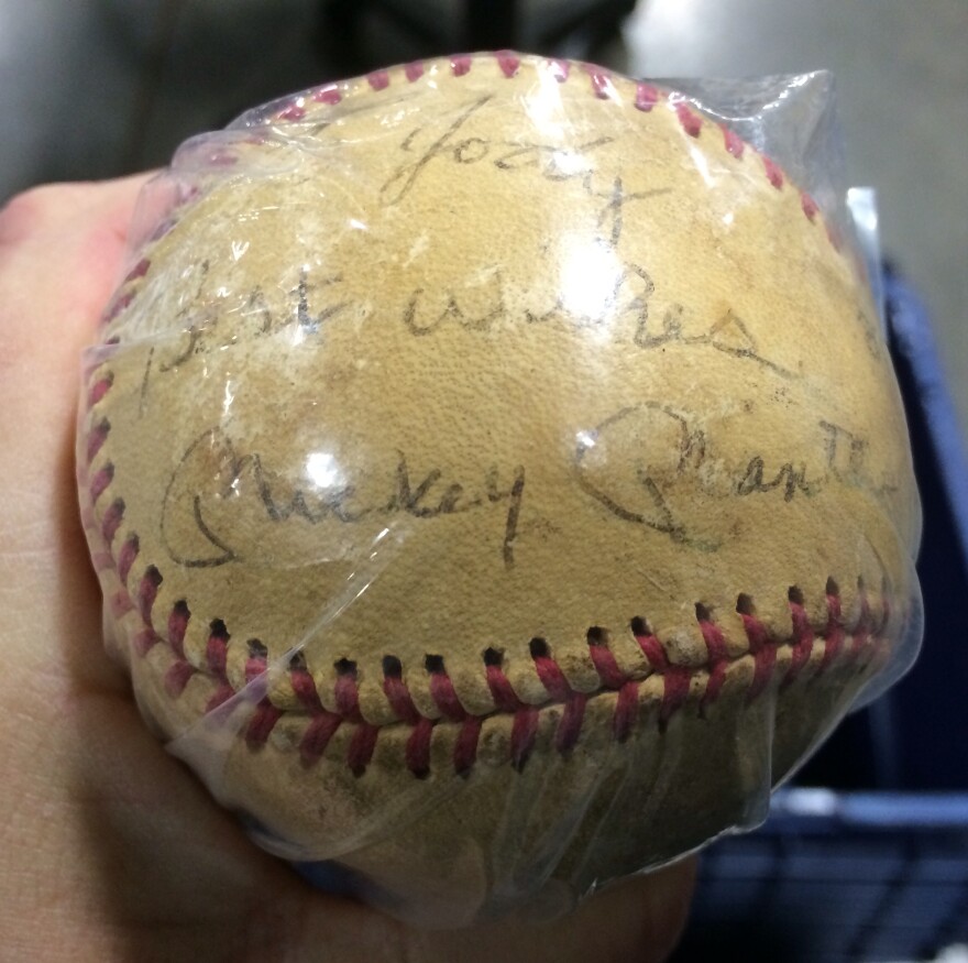 A baseball autographed by Mickey Mantle was one of many items auctioned by the state Treasurer's office.