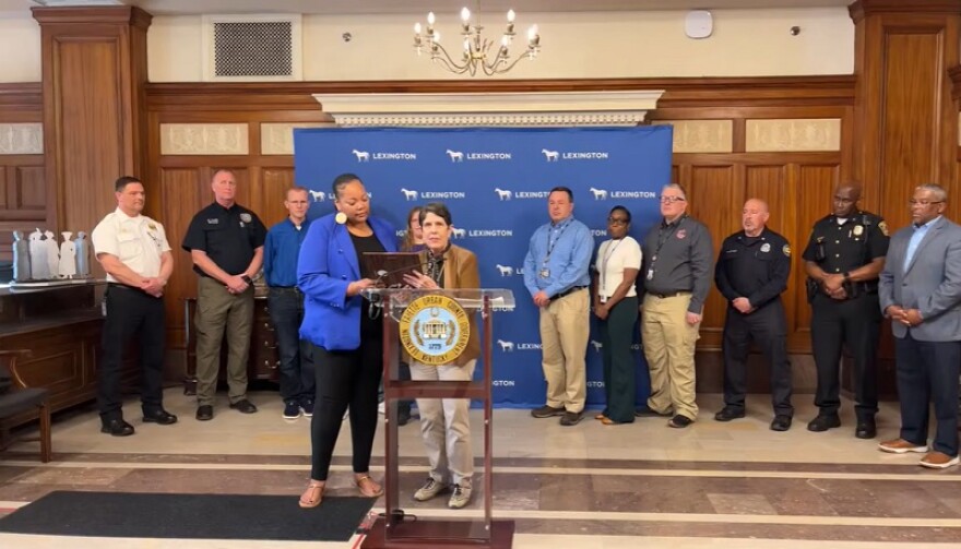 Lexington Mayor Linda Gorton reads the proclamation to Lexington E911 Center director Jonelle Patton