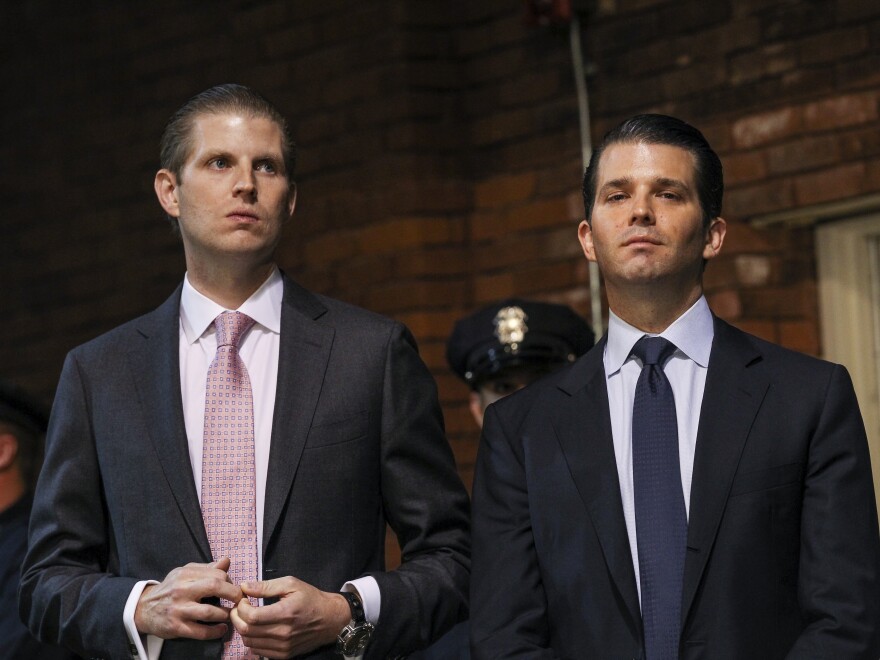 President Trump's sons Eric (left) and Donald Jr., pictured at a 2015 campaign event, are overseeing resorts still underway in places such as the Philippines and Indonesia.