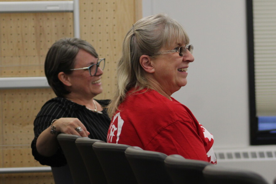 Susanna Litwiniak (left) and Annette Weigle (right) attend a Kenai Peninsula Borough School District school board meeting on Monday, Sept. 14, 2026 in Soldotna, Alaska.