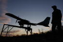 A Ukrainian serviceman launches a drone towards Russian positions at the front line in the Zaporizhzhia region, Ukraine, Oct. 7, 2026. (Andriy Andriyenko/Ukraine's 65th Mechanized Brigade via AP)
