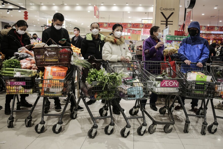 On Jan. 23, 2020, as the coronavirus spread in China, residents of Wuhan, where it was first identified, donned masks to go shopping. The U.S. didn't officially endorse masks as a preventive measure for the public for a number of weeks.