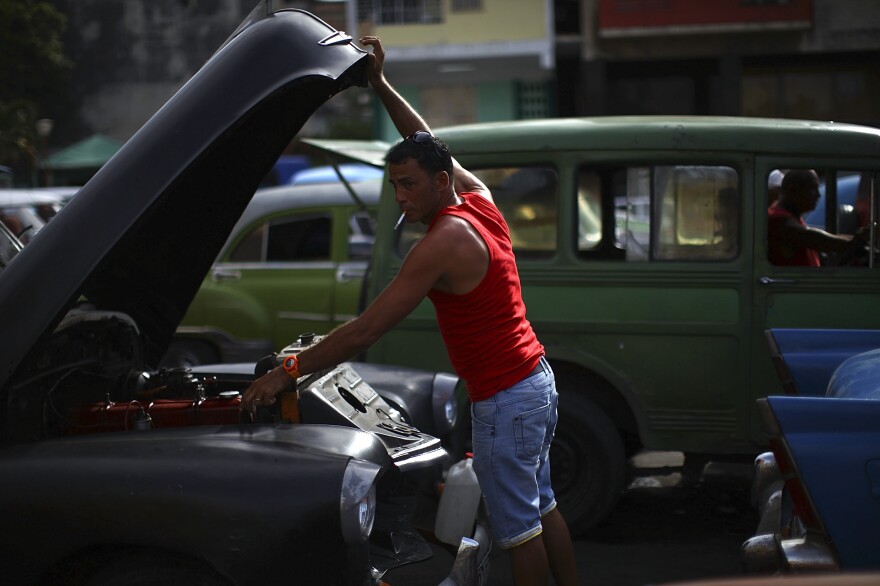 14: Red tank top and cigarette