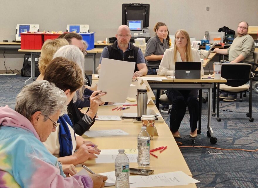 Members of the Cass County Canvassing Board prepare to review ballots Nov. 18, 2024, in Fargo. At the head of the table are Cass County Commission Chair Chad Peterson, left, and Finance Director Brandy Madrigga.