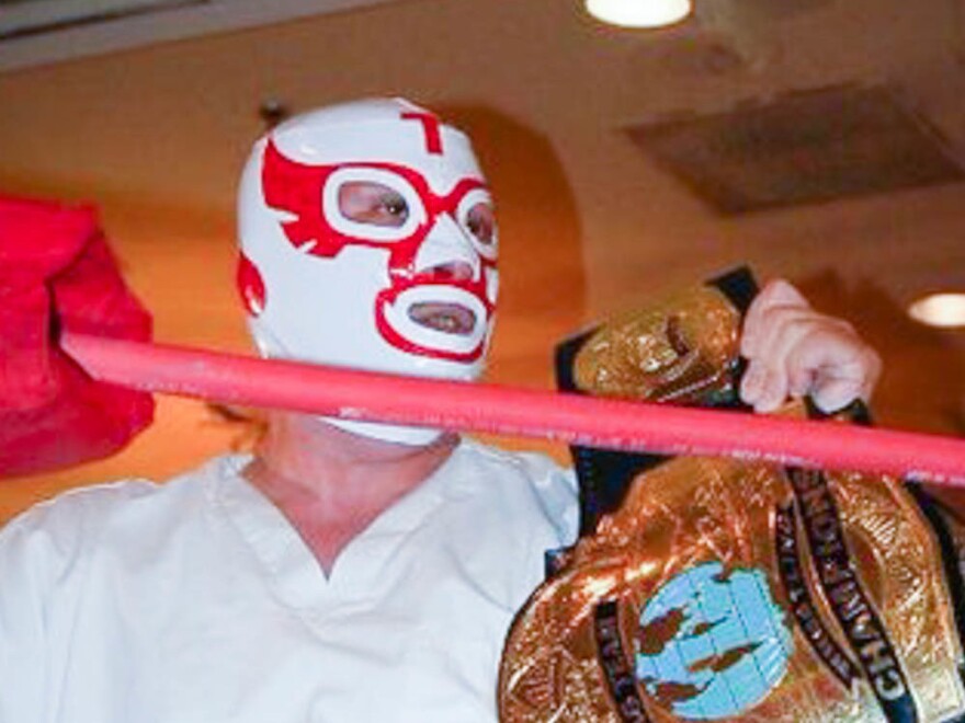 John Torres Sr., who wrestled as The Falcon, is pictured at a wrestling match in 2010. Torres moonlit as The Falcon, working a variety of jobs such as truck driver and barber during the day.