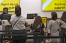 FILE - Passengers wait in a line for help at the Spirit Airlines ticket counter at the Tampa International Airport Thursday, June 1, 2023, in Tampa, Fla.
