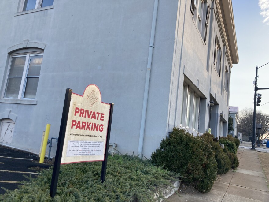 Private Parking sign next to the Saye Building. Athens First United Methodist Church hopes to demolish the historic Saye Building and expand the existing parking lot by 14 spaces.