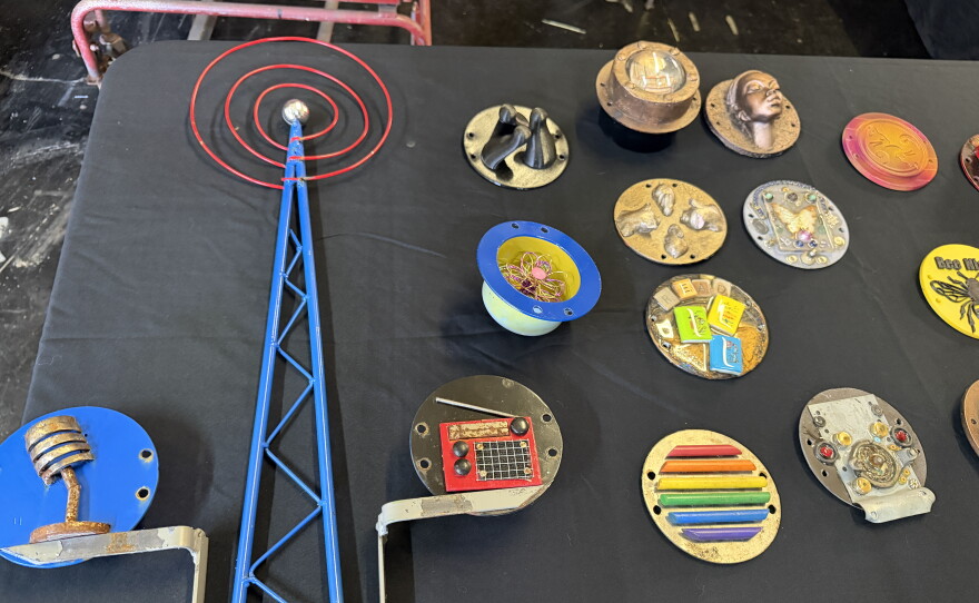 Several of the different parking meter artworks that will be shown at The Oblivion Gallery. The item on the left was on a parking meter across the street from KLCC's downtown Eugene studios.