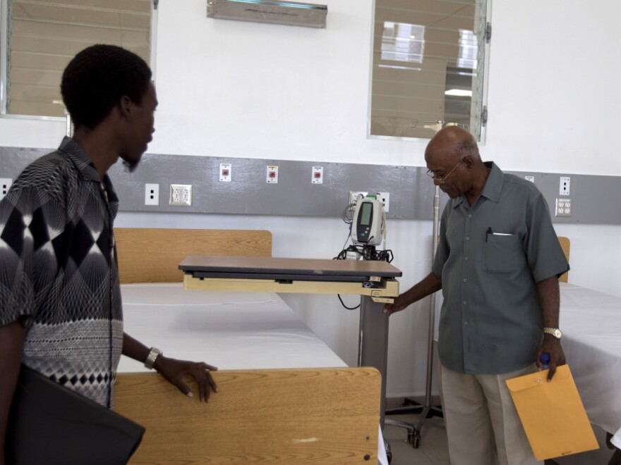 Visitors tour the new teaching hospital in Mirebalais on Jan. 10. The hospital will have a CT scan machine — one of only four in the country, and the only one at a public facility.