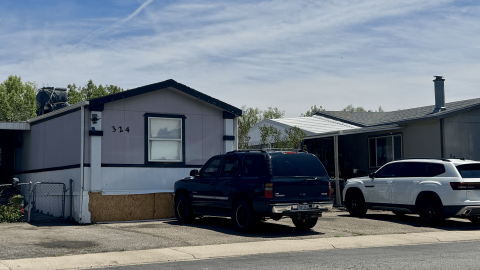 Multiple homes with cars parked outside