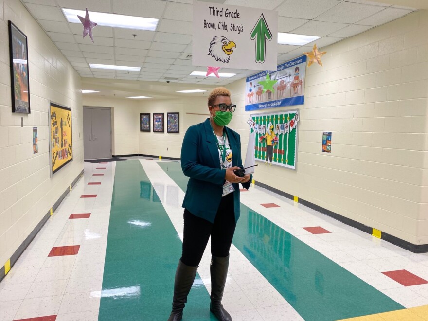 Oakdale Elementary Principal Mary Weston prepares to greet students as they return to in-person classes Feb. 15.