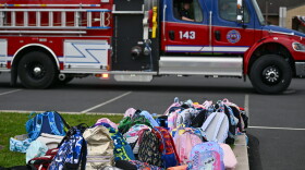 Childrens' bookbags sit outside of the Wyoming Area Catholic School after children were bused to Wyoming Area Secondary School following a fire at the Catholic school on Tuesday, Sept. 1, 2026.