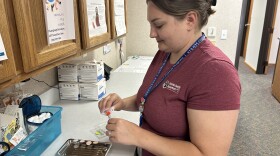District Health Department No. 10 Public Health Nurse Ashlie Baker prepares a COVID-19 vaccine for a patient. Despite the federal government's abrupt cuts to COVID-19 relief funding, DHD No. 10 still has COVID-19 vaccines available for clients at any of its clinics.