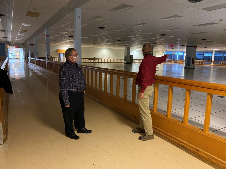 Covington City Manager David Johnston and Communications Manager Dan Hassert look at the massive vacant space once occupied by the IRS for 52 years.
