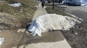 A block of snow obstructing the sidewalk on E. 14th Ave.