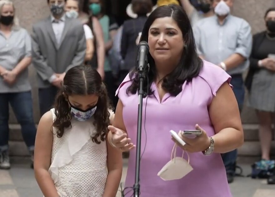 Lisa Stanton, right, with her daughter on April 14, 2021. Stanton spoke at a press conference against legislation criminalizing some health care for transgender youth.