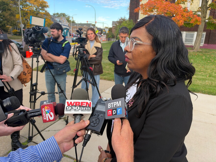 Interim superintedent at BPS meets the media outside the forum.