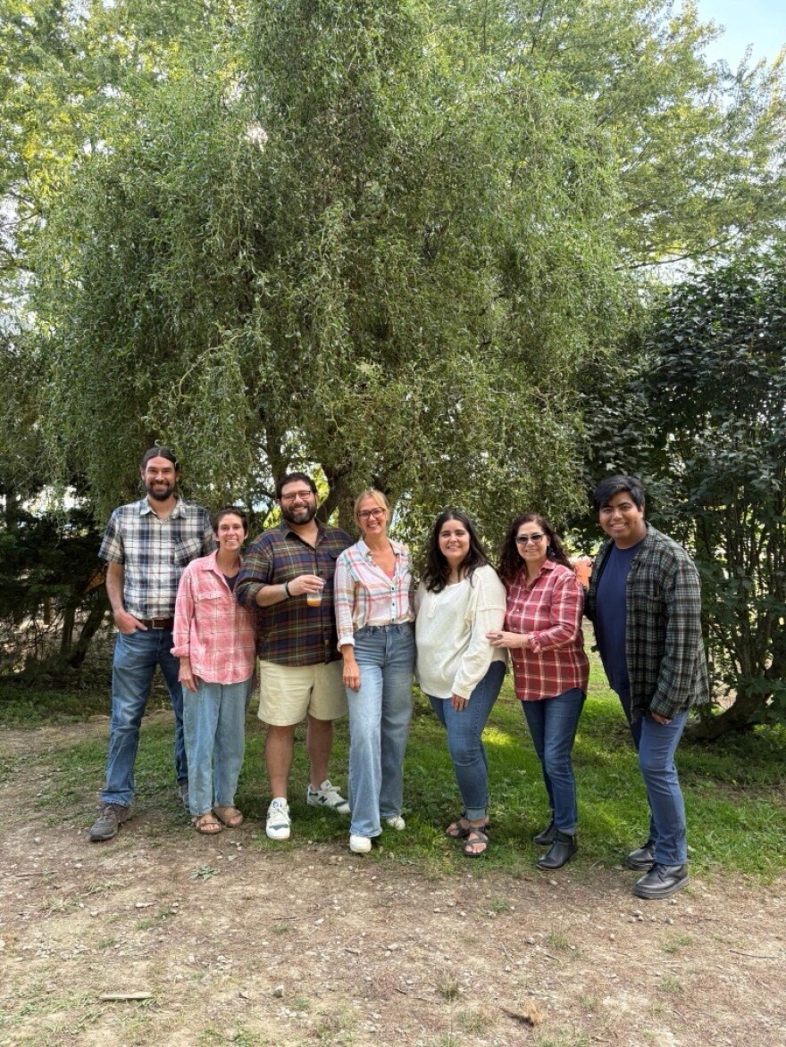 The Justice For All (Serving Immigrants) team at Pisgah Legal including Leonel Gonzalez pictured in the shorts.