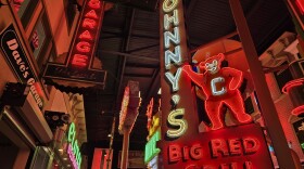 Neon signs hang in the expanded portion of the American Sign Museum