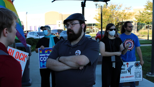 About 10 people gathered before Tuesday evening's council meeting in East Peoria's Levee Park to oppose the city's expansion of its Flock police camera program. Some were out-of-towners, whose opinions at least one councilmember said he would not consider. Ryan Gale, center, has been a vocal opponent of Flock in East Peoria. He grew up there, but now lives in nearby Creve Coeur.