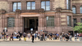 Protestors gathered outside Cincinnati City Hall Monday asking that City Council defund police in the upcoming city budget.