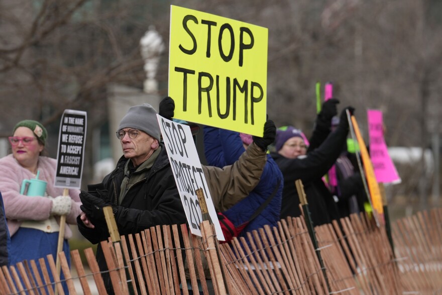 People gather for a protest against Project 2025, President Donald Trump, Elon Musk and other issues on Wednesday, Feb. 5, 2025, in Cleveland.