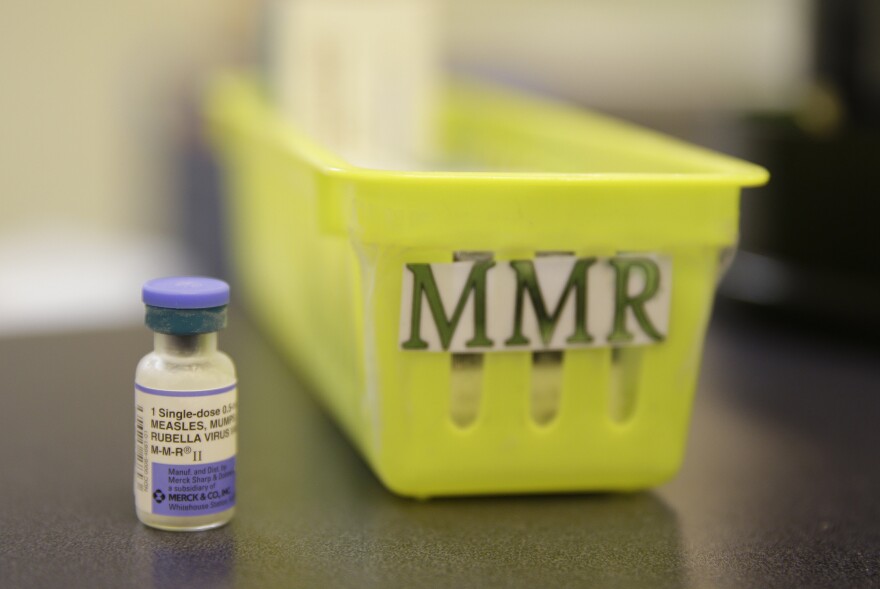 The measles, mumps and rubella vaccine is part of the CDC's recommended childhood immunization schedule. ERIC RISBERG/AP