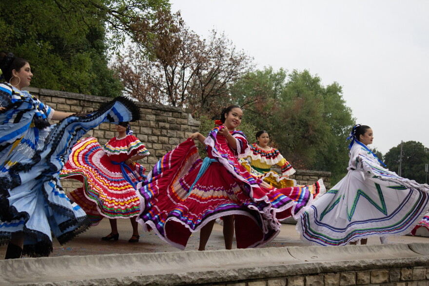 Dancers from Ballet Folklórico perform on Tuesday at Riverside Park during an ACLU of Kansas protest.