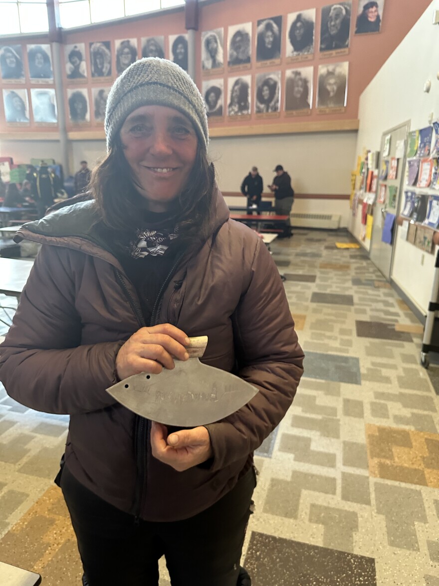 Michelle Phillips poses with a locally made uluaq, awarded for her sportsmanship.