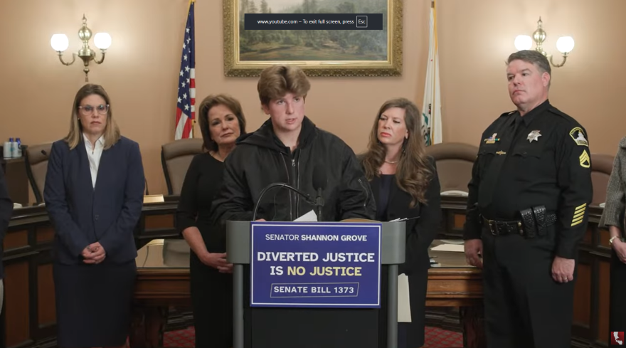 Robert Scrivner, center, speaks out against alleged child abuse by his father, former Kern County Supervisor Zack Scrivner, alongside his mother, Christina Scrivner, second from right, and State Senator Shannon Grove, second from left.Robert Scrivner, center, speaks out against alleged child abuse by his father, former Kern County Supervisor Zack Scrivner, alongside his mother, Christina Scrivner, second from right, and State Senator Shannon Grove, second from left.