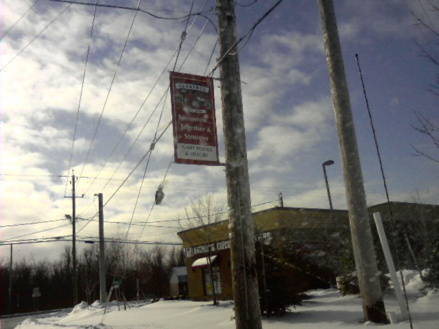 Banners in Clarence Center read Tomorrow, Together, Stronger, one year after crash of Flight 3407