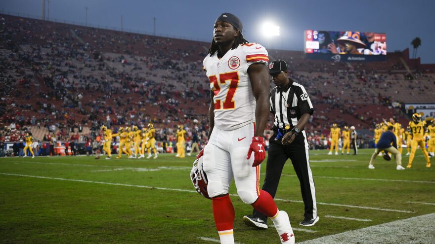 Kareem Hunt walks off the field before his last game with the Kansas City Chiefs. The Chiefs released him after the release of a video showing Hunt shoving and kicking a woman.