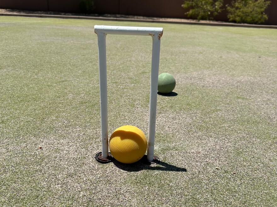 Croquet hoop and ball.
