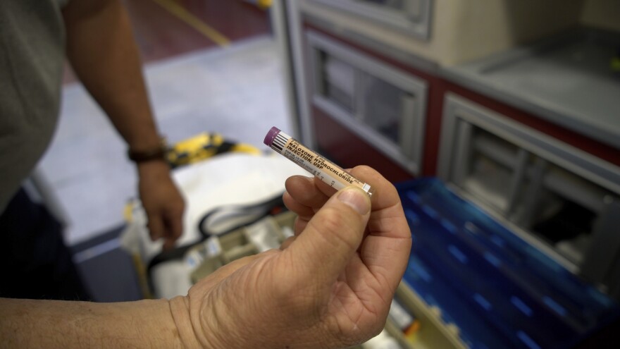 Capt. Kenny Warren holds the overdose drug naloxone in an ambulance at the Williamston, N.C., Fire and Rescue Squad on Thursday, April 11, 2024. Warren says run times have doubled since the local hospital closed last August. The struggle to reopen the city's only emergency room could signal trouble for President Joe Biden's re-election campaign, which is centered around his health care accomplishments.