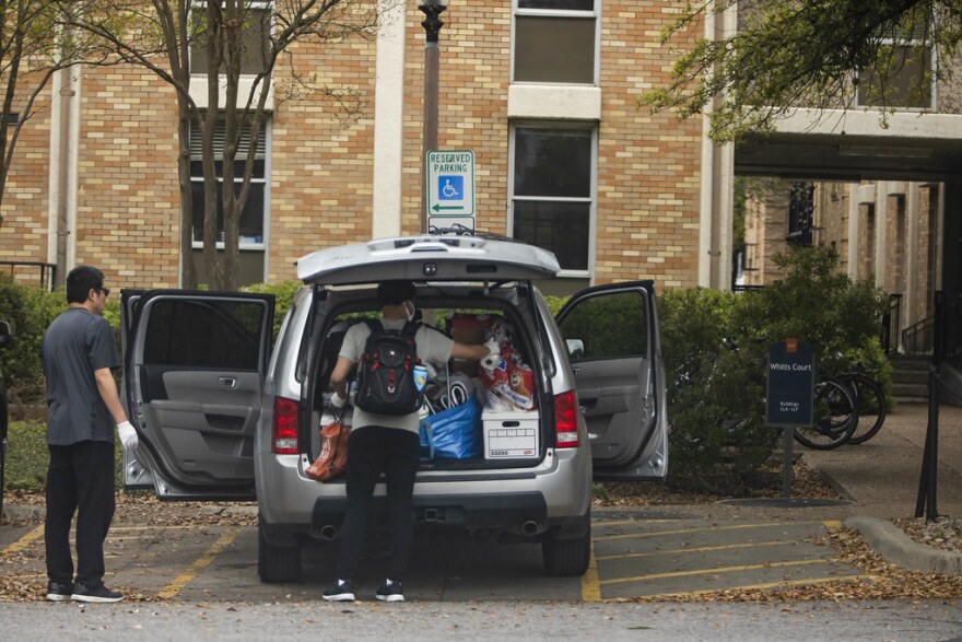 Students pack their belongings on the UT Austin campus on March 18, after the university system asked students not to return from spring break.