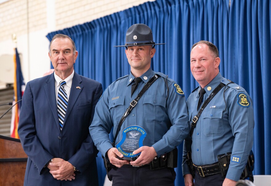 Keaton Siebenaler, center, receives the Colonel C.E. "Mel" Fisher Superintendent's Award from the Missouri State Highway Patrol, in this photo with Gov. Mike Kehoe, left, and MSHP Superintendent Col. Michael Turner, right.