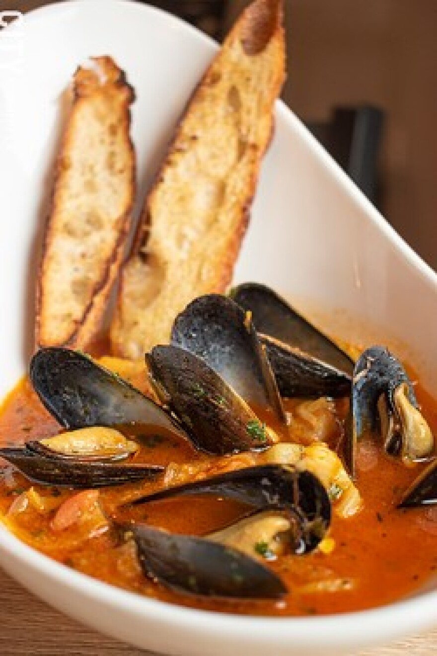At The Peppered Pig, the bouillabaisse -- a Provençal seafood stew of various fish, shellfish, fennel, saffron, and tomatoes -- contains scallops, mussels, and grouper.