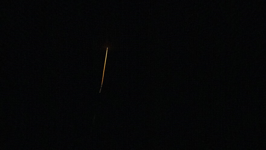 The SpaceX Crew Dragon Endeavour spacecraft is seen streaking across the sky as it comes in for a splashdown in the Atlantic off Cape Canaveral early Tuesday morning.