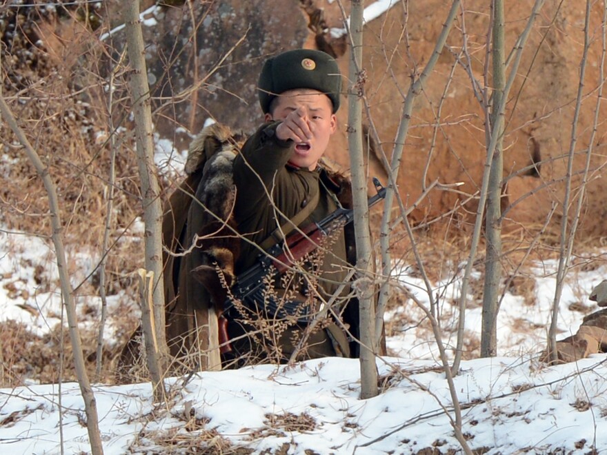 A North Korean soldier reacts as he patrols along the Yalu River near the Chinese border last month.