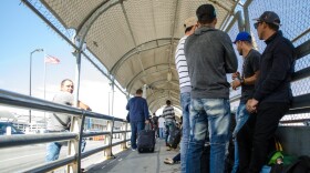 People line up at the U.S.-Mexico border in Juarez waiting to cross into El Paso.