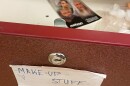 In the foreground, the front of an open drawer with an index card attached that says "make-up stuff" in handwritten letters. Inside the drawer, out of focus, is a label with pictures of people in gray hair and beards that says "Aging" at the top.