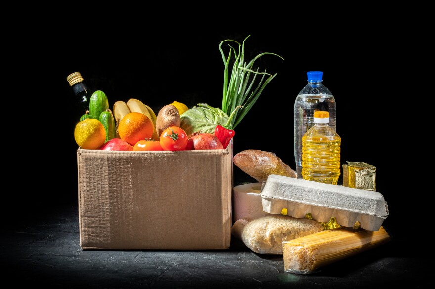 Food donations of different products on dark background