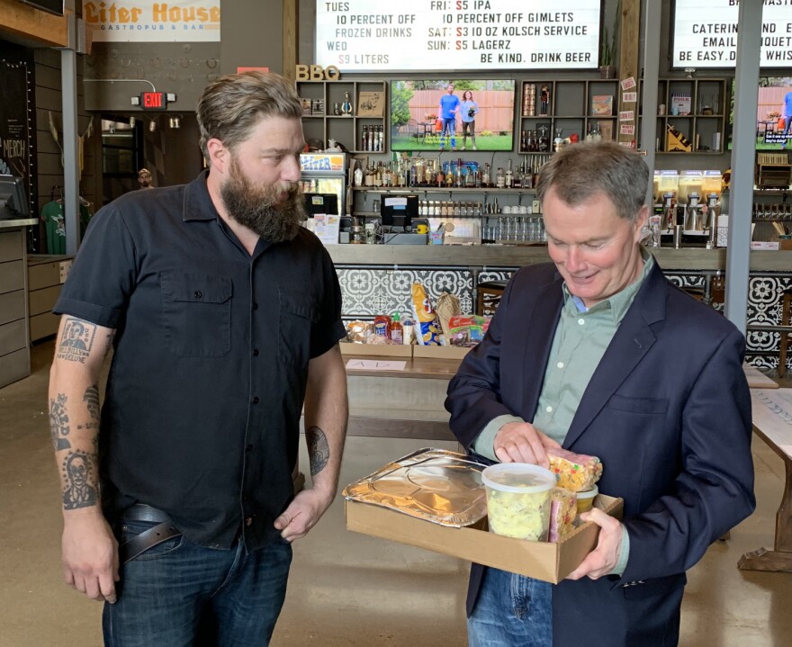 Mayor Joe Hogsett picks up dinner at Half Liter. (Jill Sheridan WFYI)